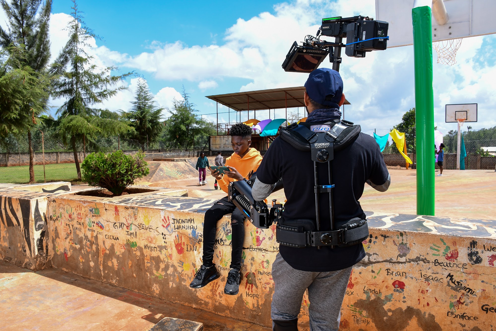 Gimbal operator capturing moving shots at a Kenyan location